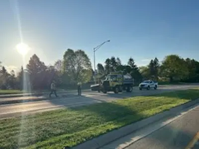 Highway operations workers on the road in trucks