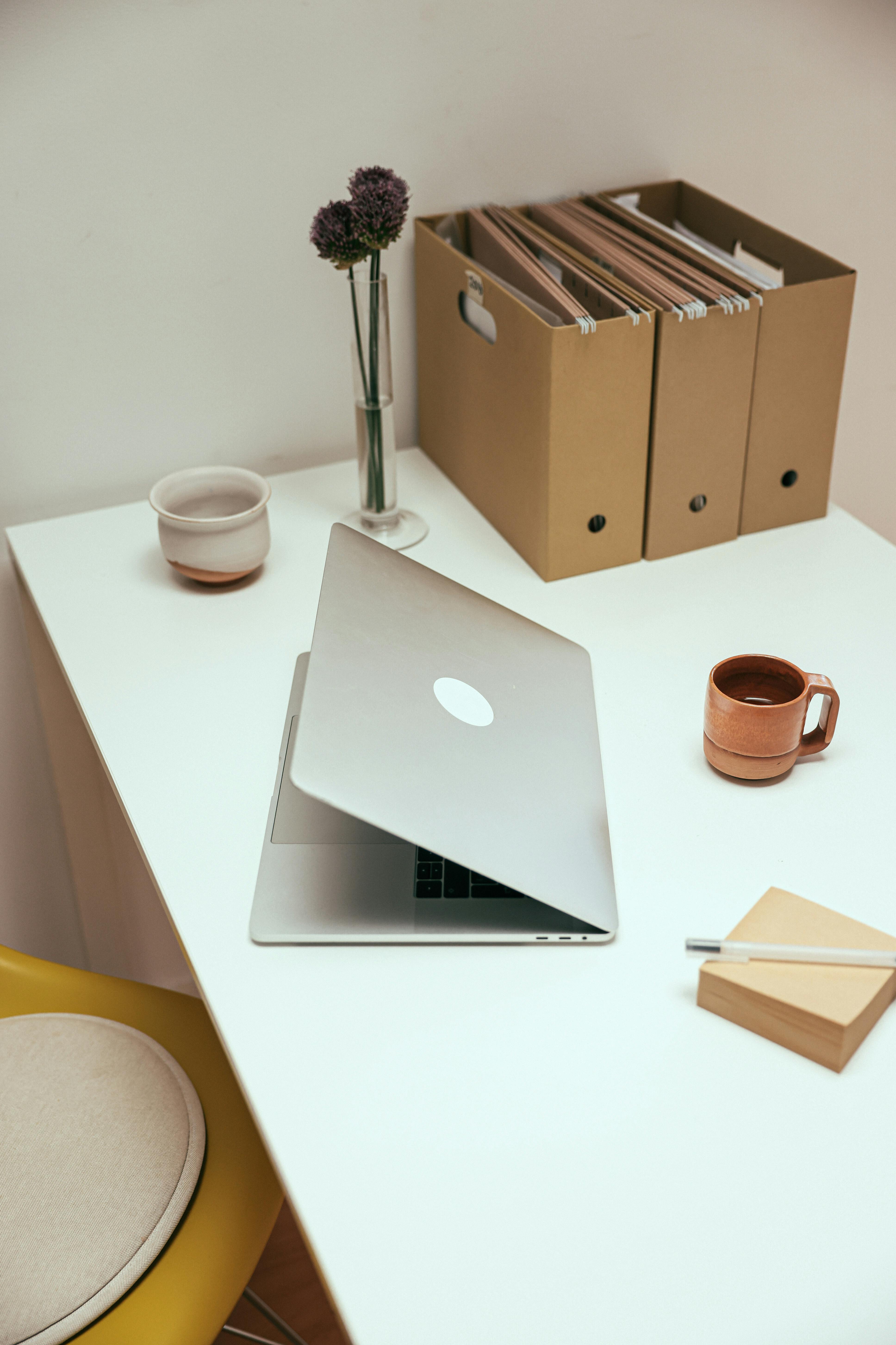 Desk with laptop computer and document binders